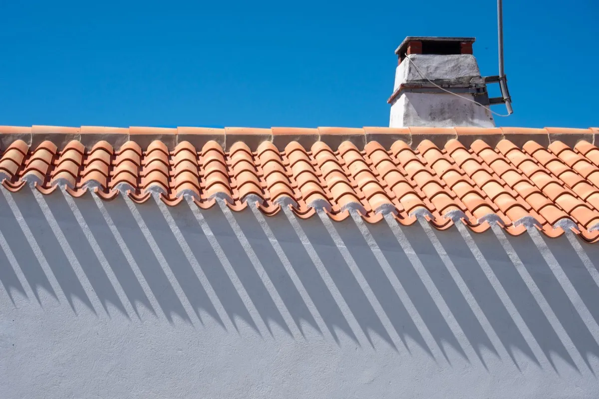 Roof ridge line and chimney on a home in Stephenville, TX